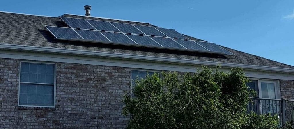 Solar panels soaking up the sun above Cambridge Place Apartments, supporting green living in Iowa City